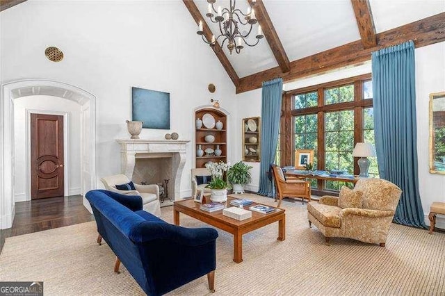 living room featuring an inviting chandelier, hardwood / wood-style floors, built in features, high vaulted ceiling, and beam ceiling