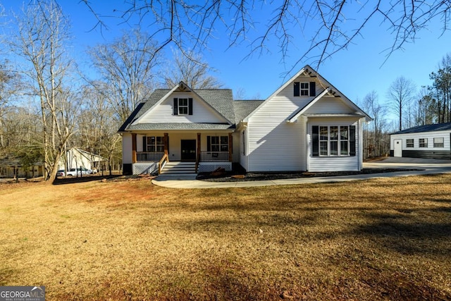 view of front of home featuring a porch and a front lawn