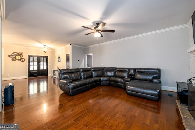 living room featuring french doors, ceiling fan, ornamental molding, and dark hardwood / wood-style floors