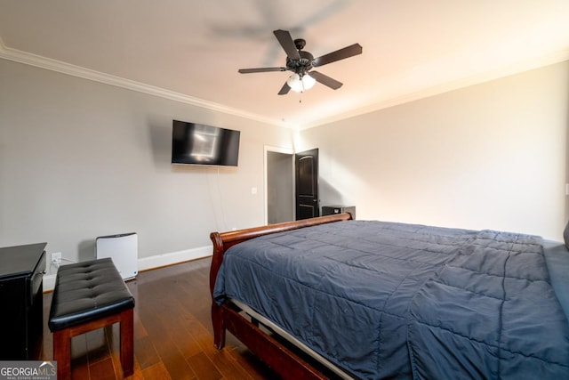 bedroom with dark wood-type flooring, ceiling fan, and crown molding