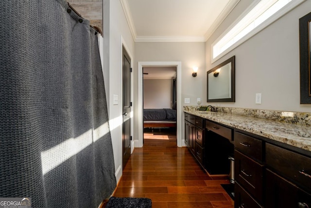 bathroom featuring ornamental molding, curtained shower, and vanity