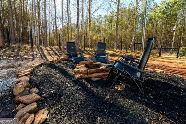 view of yard featuring an outdoor fire pit