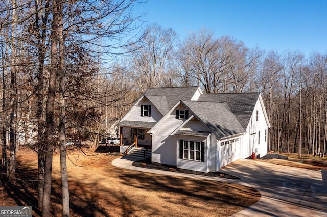 view of front of property with a porch and a garage