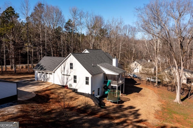 view of side of home with a garage