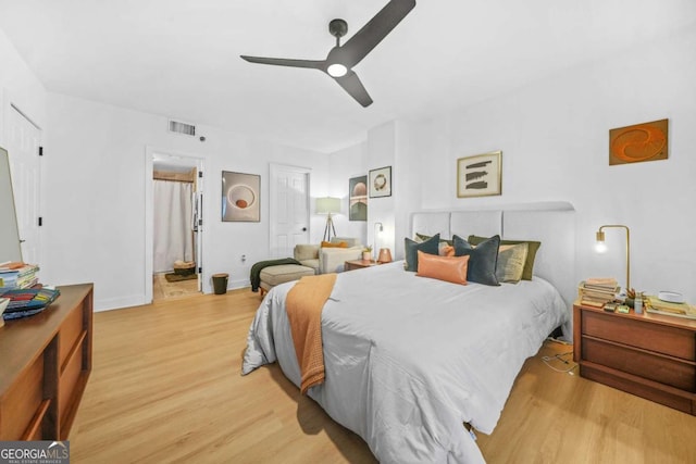 bedroom with light wood-type flooring and ceiling fan