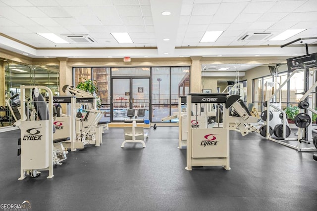 exercise room with a drop ceiling