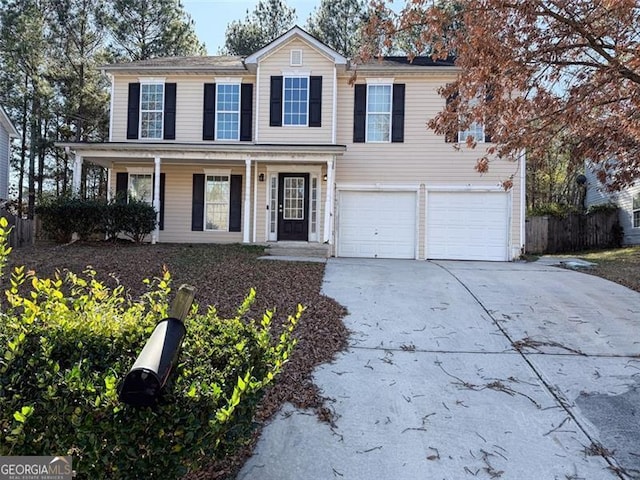 view of front of home with a garage and covered porch