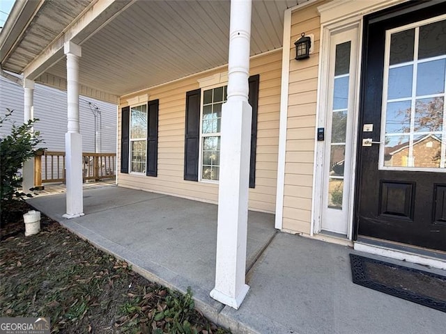 property entrance featuring covered porch