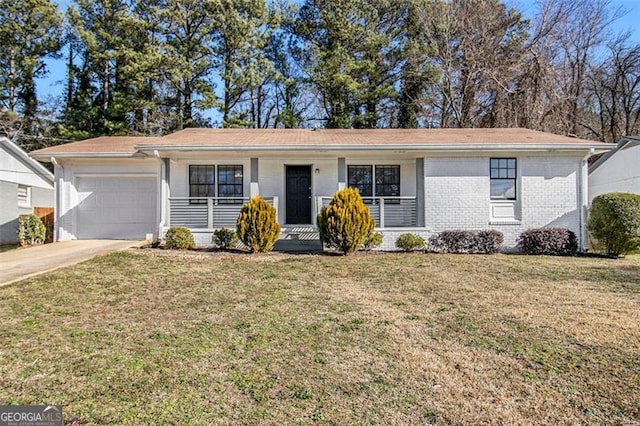 single story home featuring a front yard, a porch, and a garage