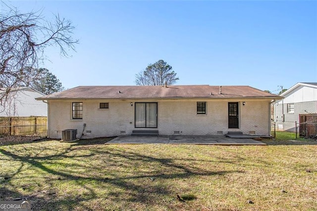 back of house featuring a patio area, cooling unit, and a yard