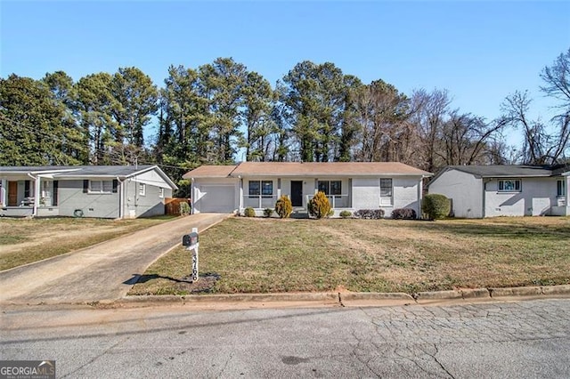 ranch-style home with a garage and a front yard