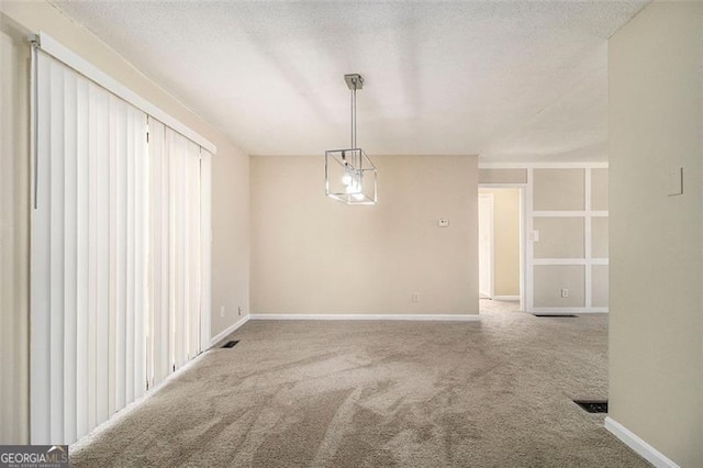 spare room featuring carpet floors