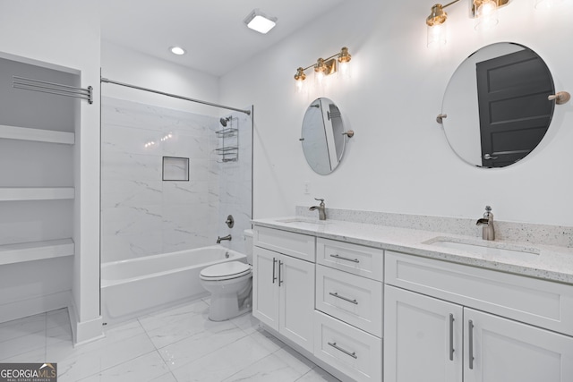 full bathroom with tiled shower / bath, vanity, and toilet