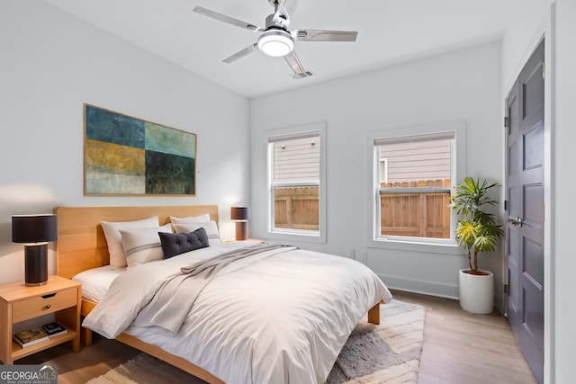 bedroom featuring ceiling fan and light hardwood / wood-style flooring