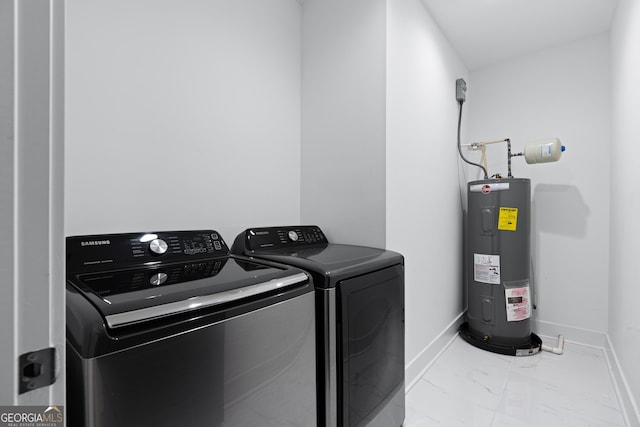 laundry room featuring independent washer and dryer, light tile patterned floors, and electric water heater