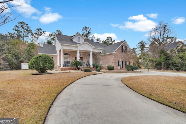 view of front of house with a front lawn and a porch