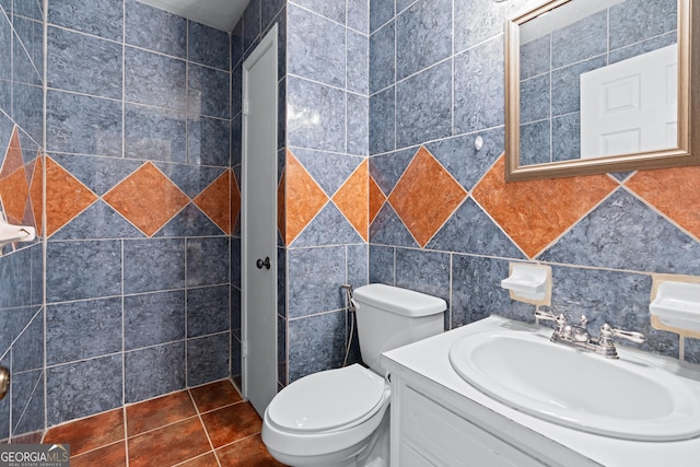 bathroom with vanity, tile patterned floors, and toilet