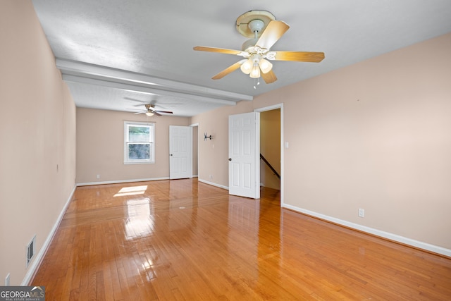 unfurnished room with hardwood / wood-style flooring