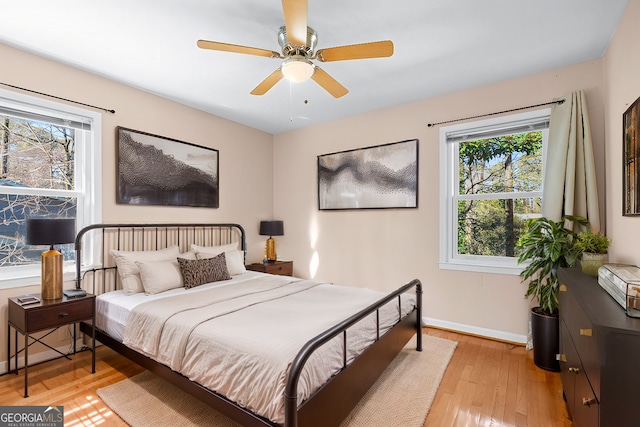 bedroom featuring light hardwood / wood-style flooring and ceiling fan