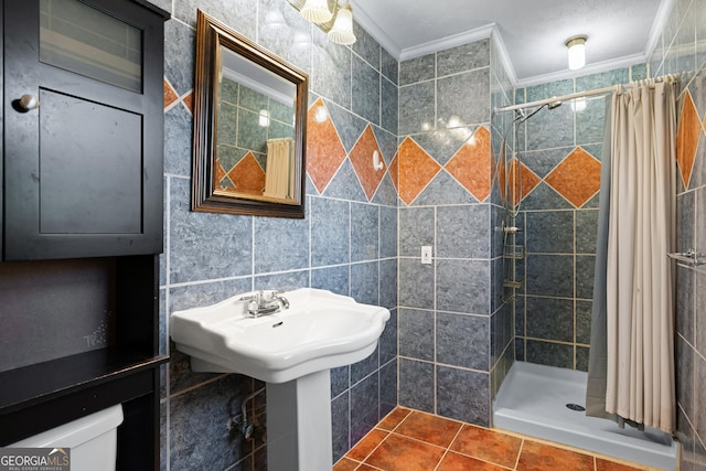 bathroom with tile patterned flooring, crown molding, tile walls, and a shower with shower curtain