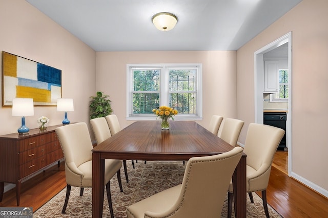 dining room with hardwood / wood-style flooring