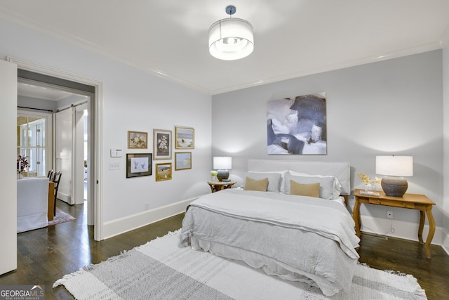 bedroom featuring ornamental molding and dark hardwood / wood-style floors