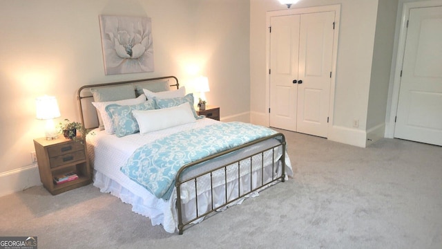 carpeted bedroom featuring a closet