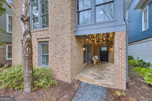 doorway to property featuring a patio area