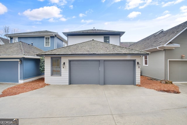 front facade with a garage