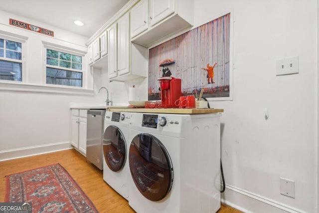 785 Ponce De Leon Pl NE Unit 8, Atlanta, GA 30306 - laundry room with washer and dryer, cabinet space, light wood-style flooring, and recessed lighting