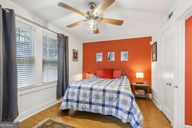 785 Ponce De Leon Pl NE Unit 8, Atlanta, GA 30306 - bedroom with wood finished floors and a ceiling fan