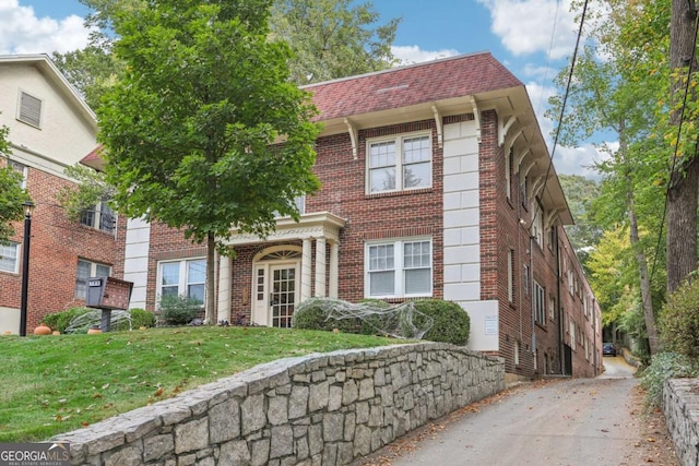 785 Ponce De Leon Pl NE Unit 8, Atlanta, GA 30306 - view of front of property featuring brick siding and a front yard