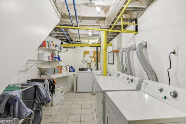 785 Ponce De Leon Pl NE Unit 8, Atlanta, GA 30306 - laundry room with washer and clothes dryer and light tile patterned floors