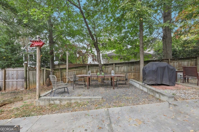 785 Ponce De Leon Pl NE Unit 8, Atlanta, GA 30306 - fenced backyard featuring area for grilling, outdoor dining space, and a patio
