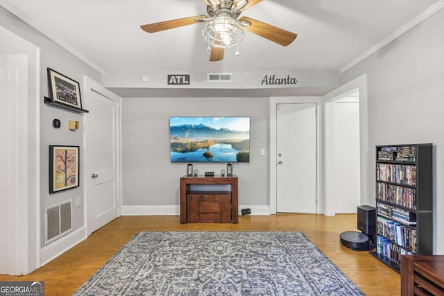 785 Ponce De Leon Pl NE Unit 8, Atlanta, GA 30306 - sitting room featuring ornamental molding, wood finished floors, and ceiling fan