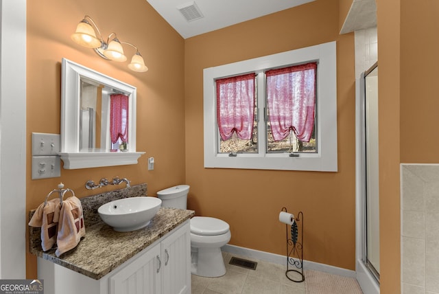 bathroom featuring a shower with door, toilet, tile patterned flooring, and vanity