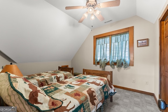 carpeted bedroom featuring vaulted ceiling and ceiling fan