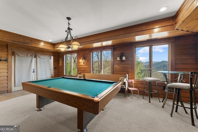 rec room featuring a mountain view, pool table, light carpet, and wooden walls