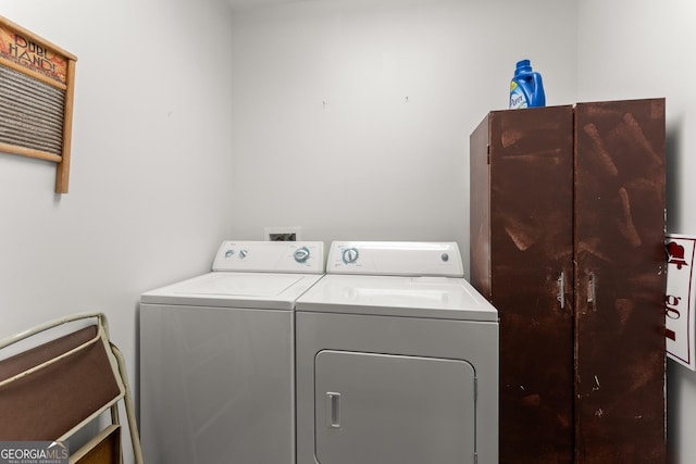 laundry area with separate washer and dryer