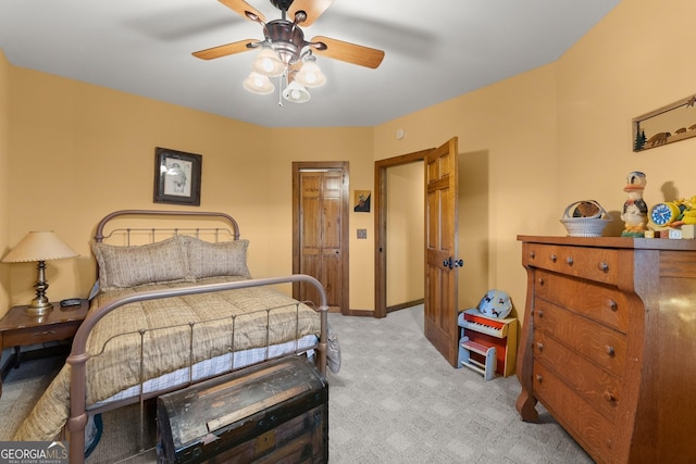 bedroom with light carpet and ceiling fan