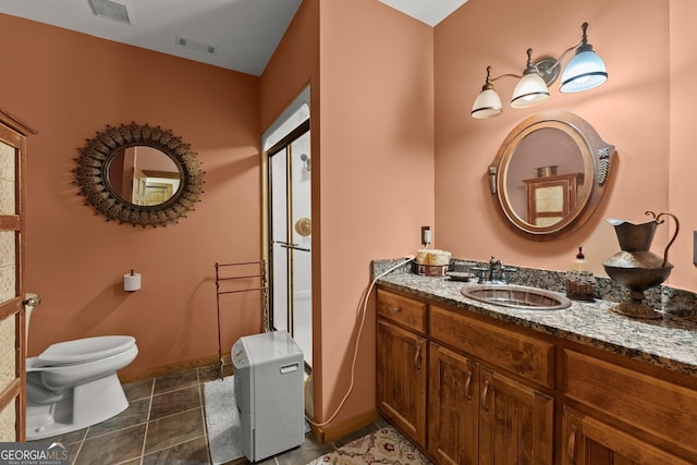 bathroom with tile patterned floors, toilet, and vanity