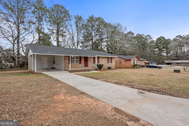 ranch-style home with a front yard and a carport