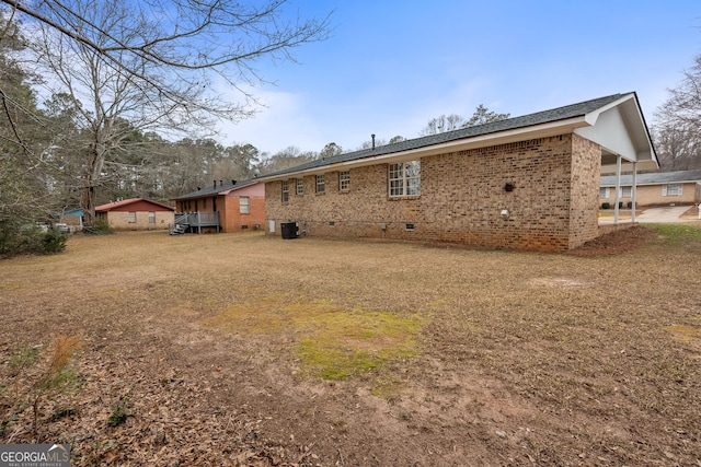 rear view of property with cooling unit