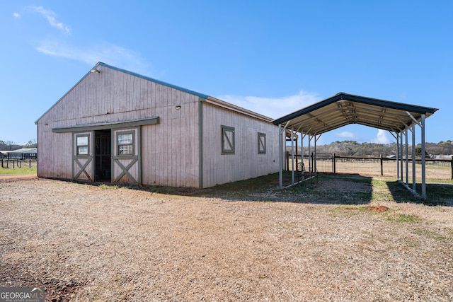 view of outbuilding featuring a rural view