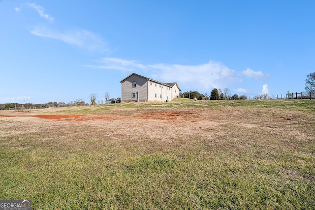 view of yard with a rural view