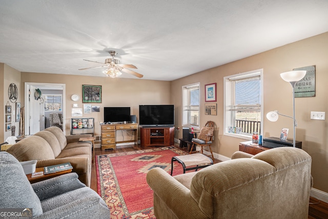 living room featuring ceiling fan and wood-type flooring