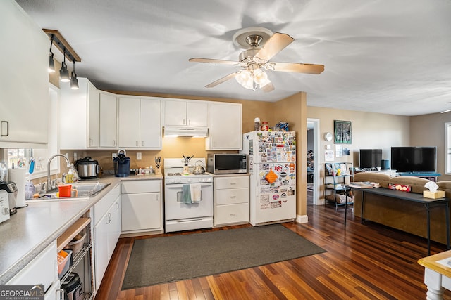 kitchen featuring sink, white cabinetry, white appliances, and dark wood-type flooring