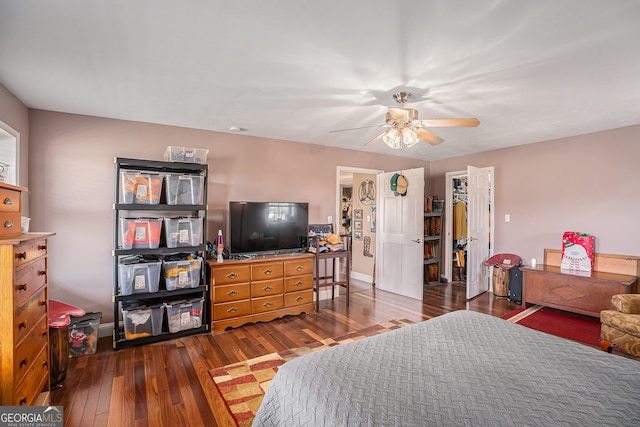 bedroom with dark wood-type flooring and ceiling fan