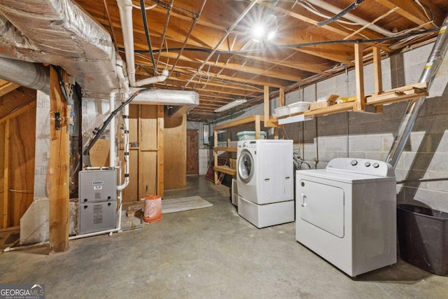 basement with separate washer and dryer and heating unit