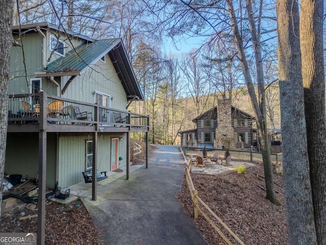 view of home's exterior with a wooden deck